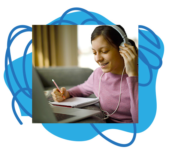 Teen takes notes while listening to headphones